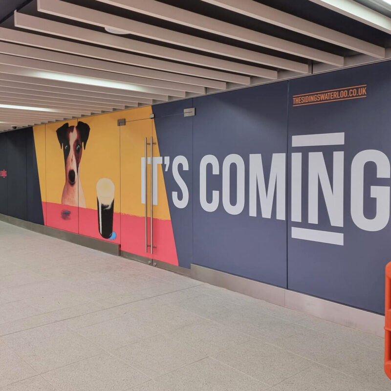 Vibrant property hoarding featuring eye-catching graphics